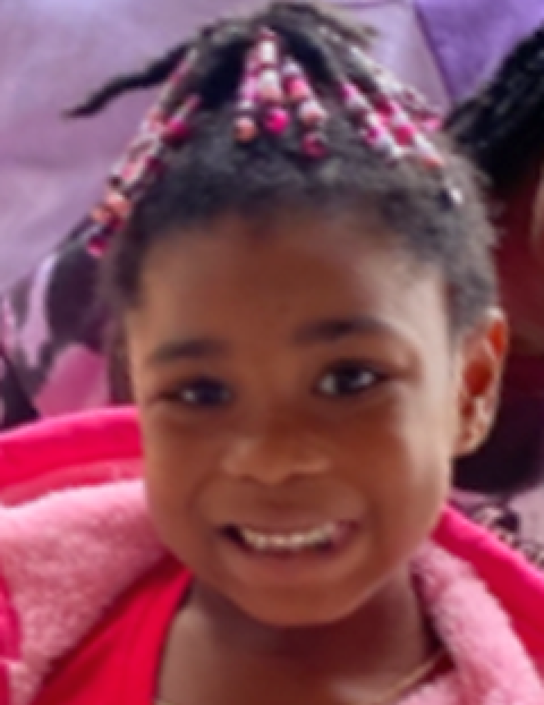 Thailynn Carter. Missing child with black hair, brown eyes, and braids.